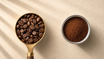 Whole roasted coffee beans and freshly ground coffee are compared side by side.