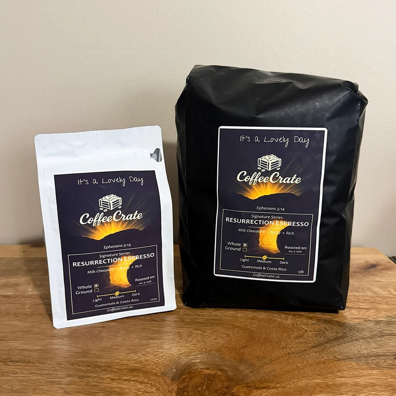 Resurrection Espresso in a white 12 oz bag on the left and a black 5 lb bag on the right.